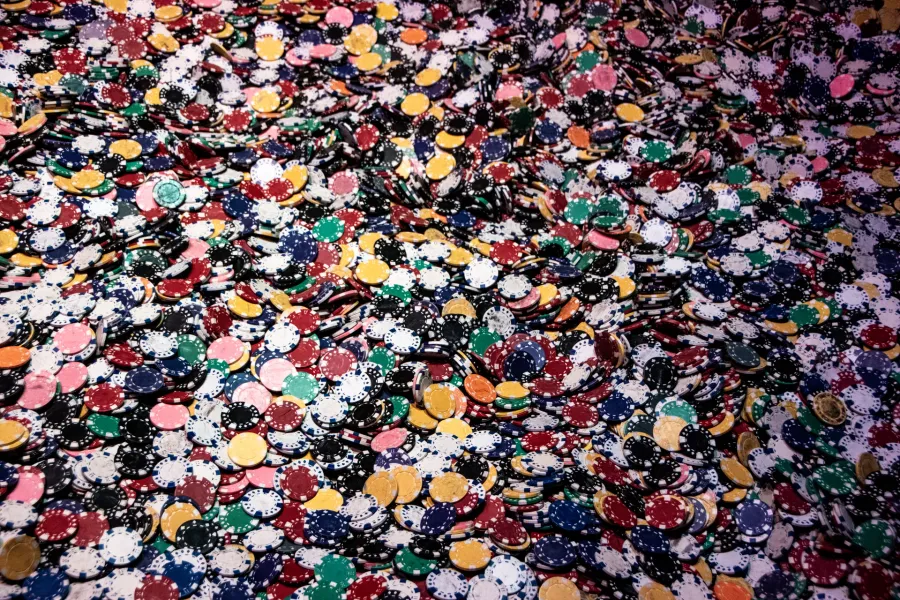 Large heap of multicoloured casino chips